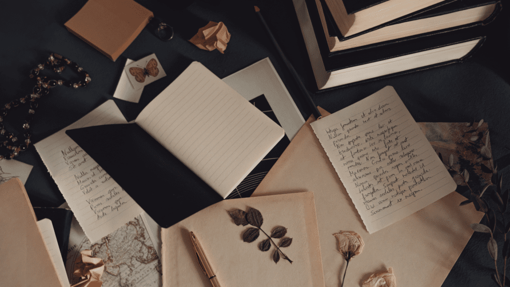 books and copies on the table accompany laptop